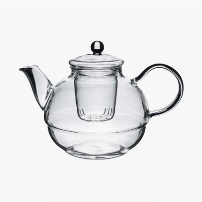 Clear glass teapot with integrated strainer and handle for brewing tea in the Glass Tea-For-One Tea Pot, Cup and Strainer Set