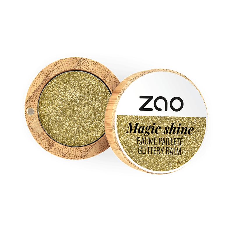 Open compact container showing sparkling gold balm labeled Magic Shine Balm 292 Gold in natural bamboo packaging