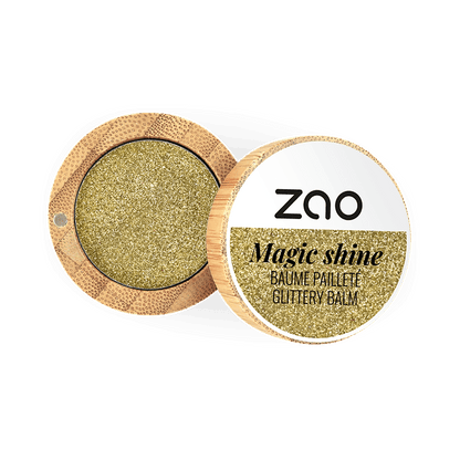 Open compact container showing sparkling gold balm labeled Magic Shine Balm 292 Gold in natural bamboo packaging