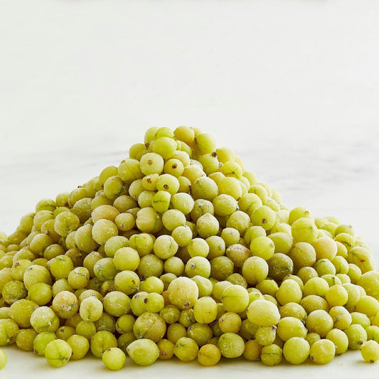 Pile of gooseberries on a white background