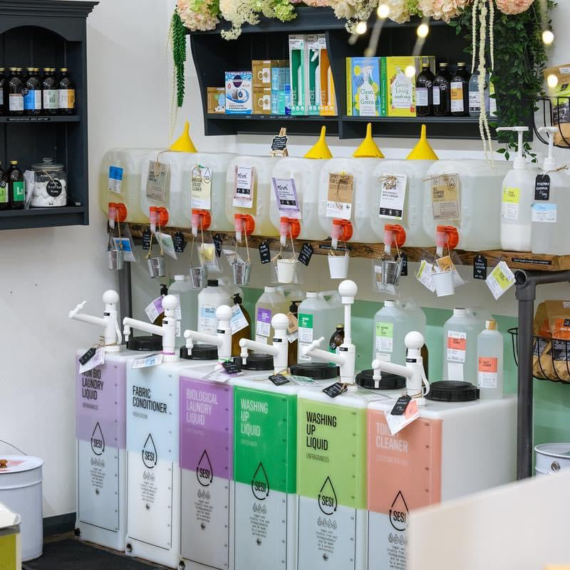 Display of cleaning product dispensers and in a store setting.