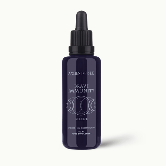Blue bottle labelled 'Brave Immunity' with dropper on a white background