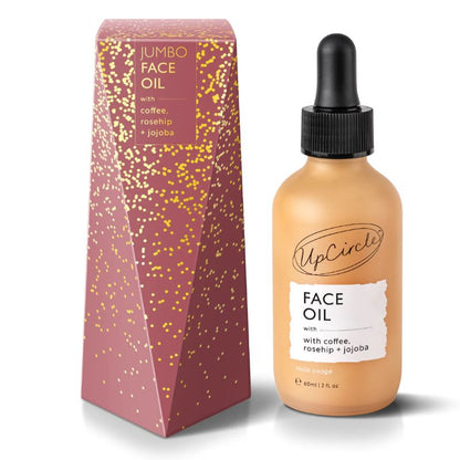 UpCircle face oil bottle and packaging on a white background