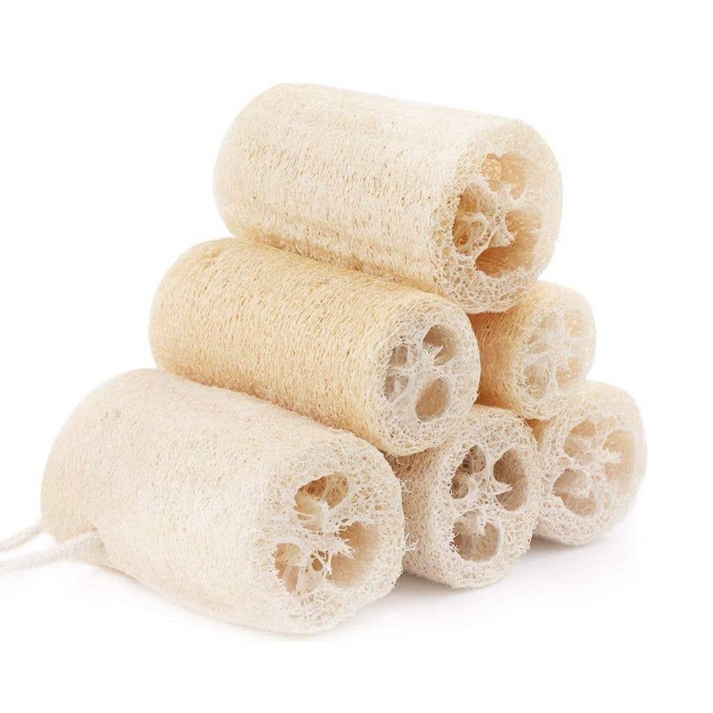 Stack of natural loofah sponges on a white background
