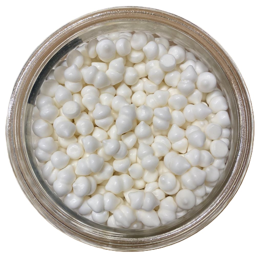 Jar filled with small meringues on a white background