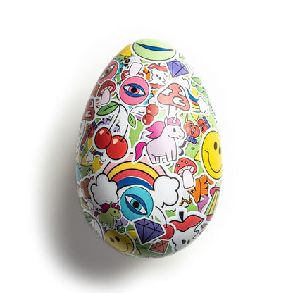 Colorful refillable Easter Egg Tin covered with playful stickers including unicorns, rainbows, cherries, and smiley faces