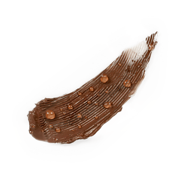 Close-up of brown mascara swatch with droplets on a white background