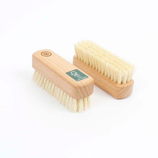 Two wooden brushes with natural bristles on a white background