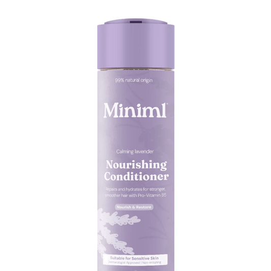 Purple bottle of 'Miniml' nourishing conditioner on a white background