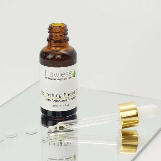 Bottle of Flawless Nourishing Facial Oil with dropper on a white background