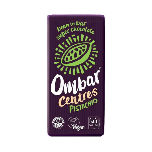 A packaged Ombar Centres Pistachio bean to bar super chocolate bar, featuring a dark purple wrapper with a green pistachio illustration and white, green, and gold text.