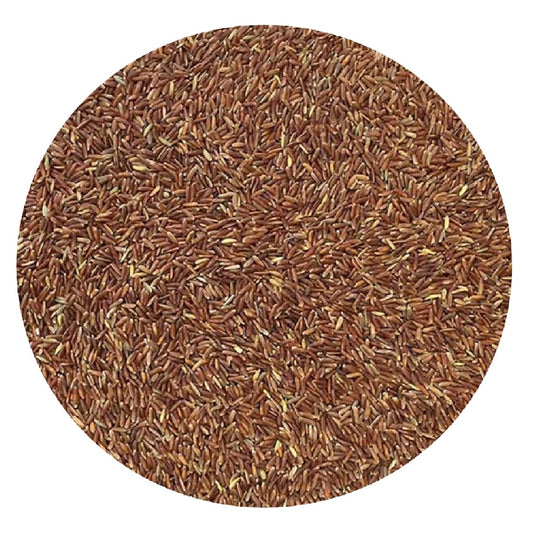 Close-up of red rice grains on a white background