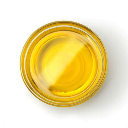 Clear glass bowl filled with carrier Oil ORGANIC representing natural skincare and sustainability