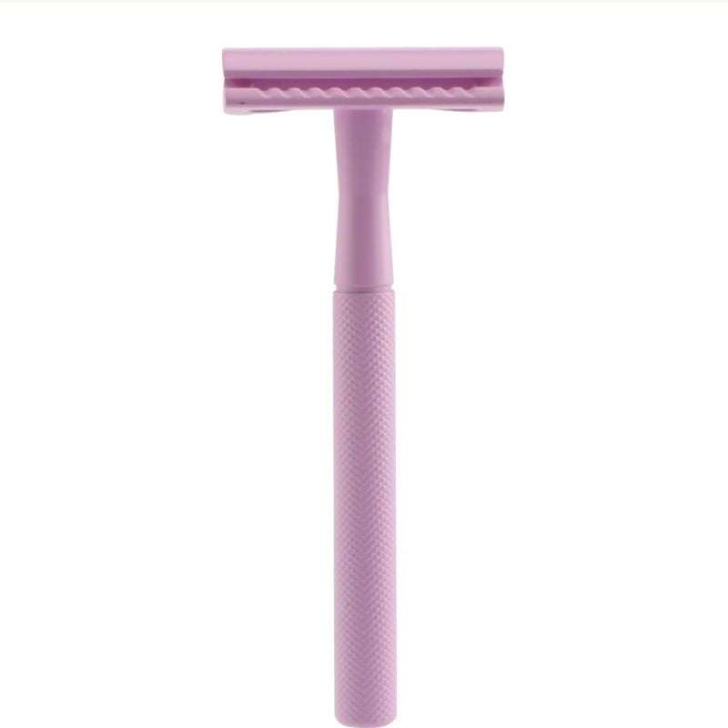 Pink safety razor on a white background