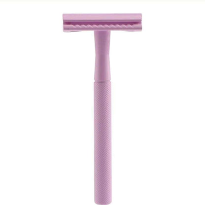 Pink safety razor on a white background