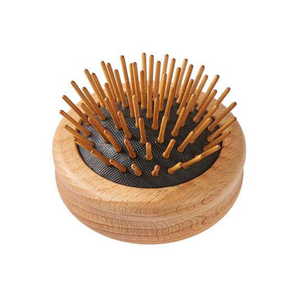 Wooden hairbrush with wooden bristles on a white background