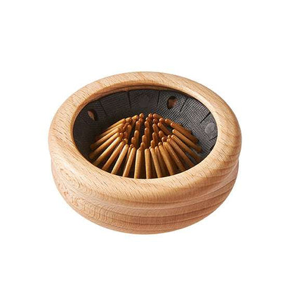 Wooden Travel Pop-Up Hairbrush folded compact with natural wood bristles and round wooden casing for easy storage