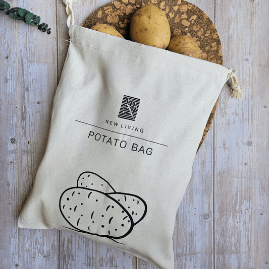 Potato bag with 'New Living' branding on a wooden surface