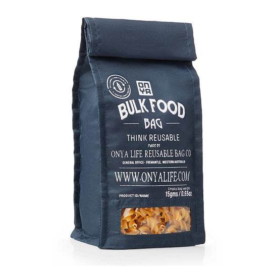 Navy reusable bulk food bag with pasta visible on a white background