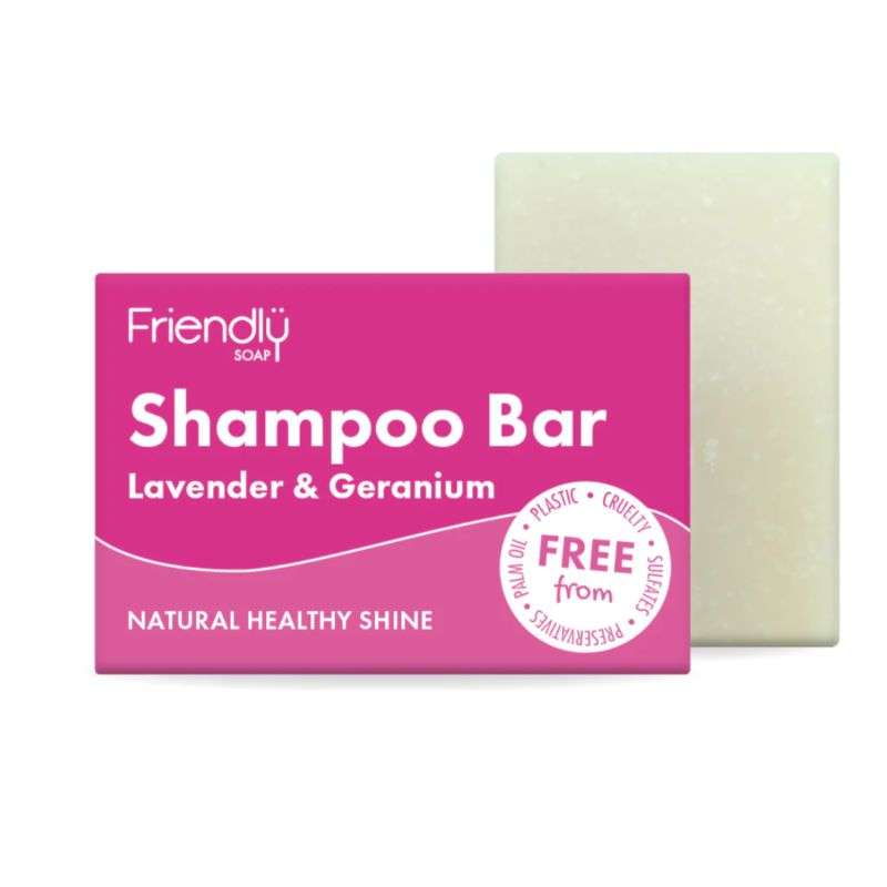 Shampoo bar with pink packaging labeled 'Friendly Soap' on a white background
