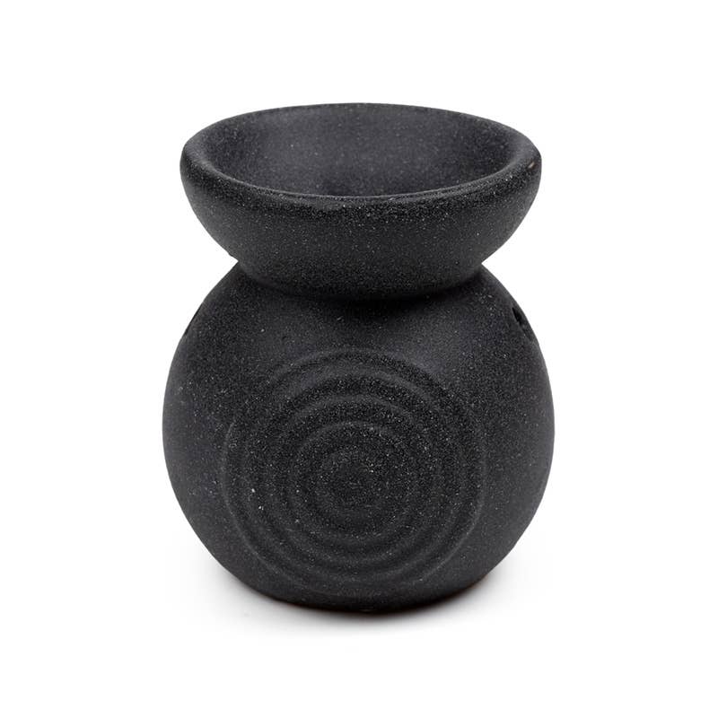 Black textured oil burner on a white background