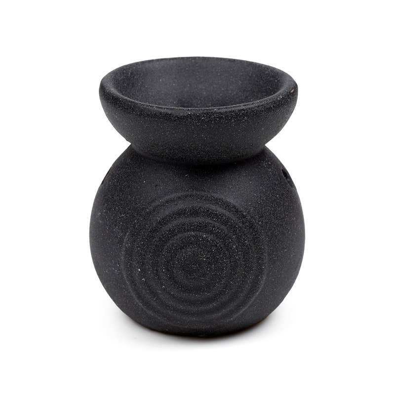 Black textured oil burner on a white background