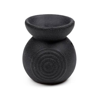 Black textured oil burner on a white background