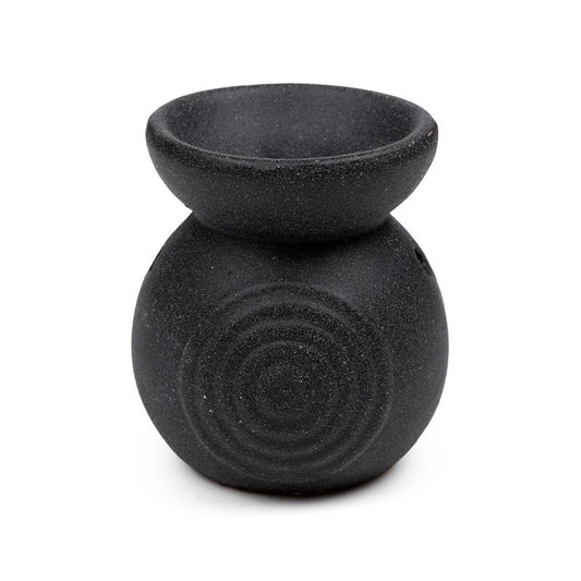 Black textured oil burner on a white background