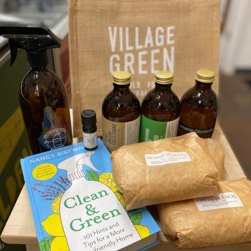 A collection of natural cleaning products, alongside a 'Clean & Green' Nancy Birtwhistle book.  A good starter kit for those wanting to go back to basics!