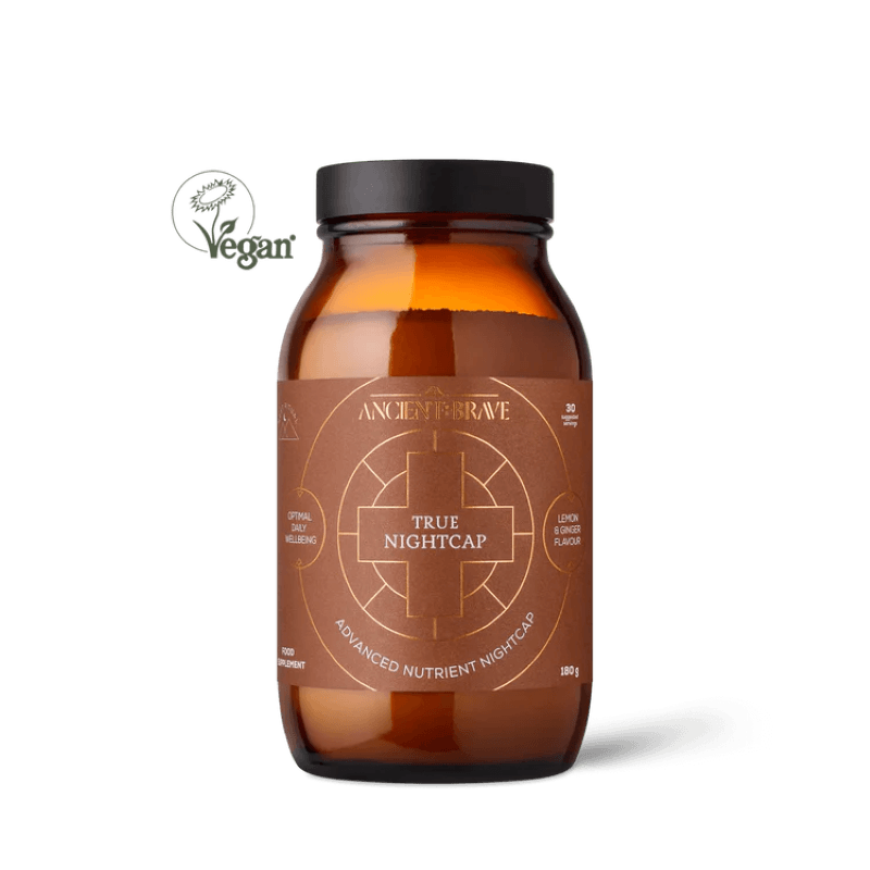 Brown supplement bottle labeled 'True Nightcap' with a black cap on a white background