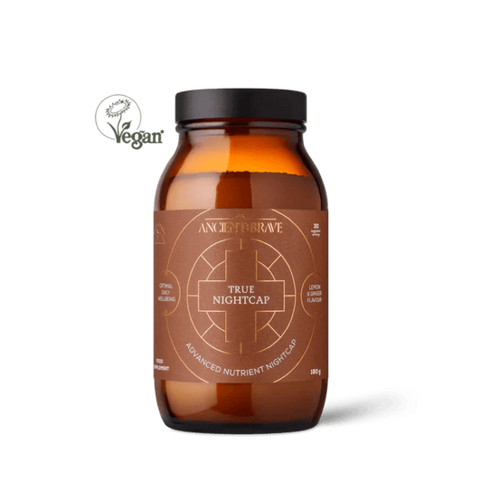 Brown supplement bottle labeled 'True Nightcap' with a black cap on a white background