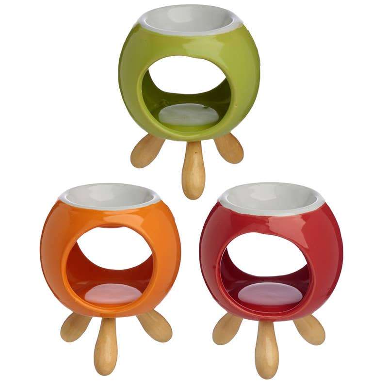 Set of three Round Ceramic Oil Burner/Wax Melter with Feet in green, orange, and red, perfect for sustainable homes.
