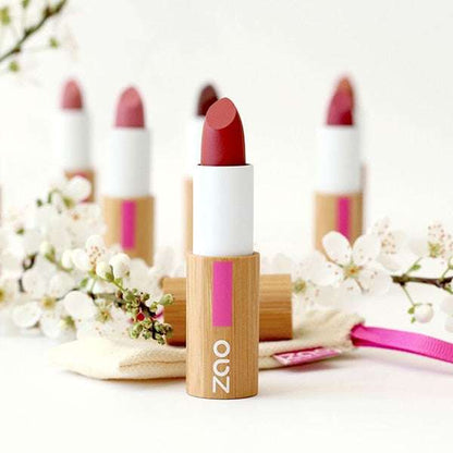 Classic Matt Lipstick REFILLABLE in eco-friendly bamboo packaging surrounded by delicate white flowers in bright natural light