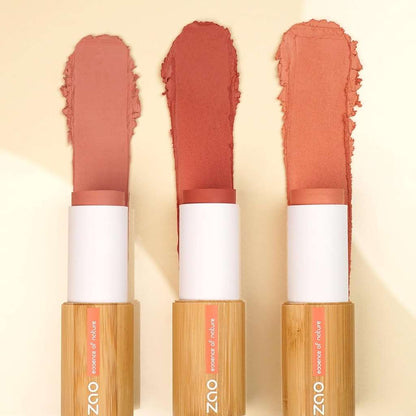 Three shades of Blush Stick ORGANIC (10g) with creamy texture on a light background