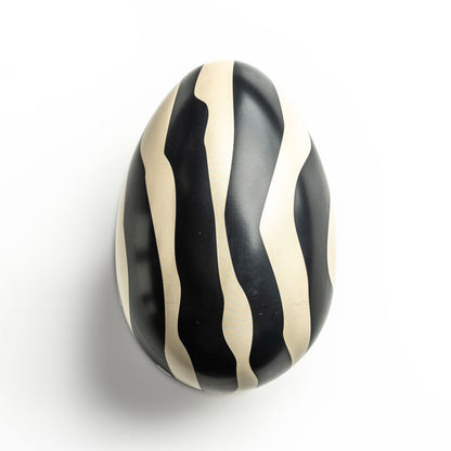 Refillable Easter Egg Tin with black and cream wavy stripes, perfect for eco-friendly gifting and storage.