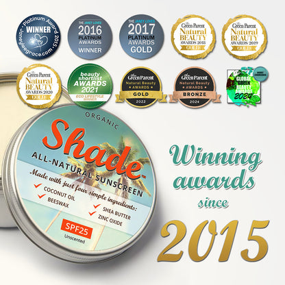 Organic Shade sunscreen tin with multiple awards displayed on a white background