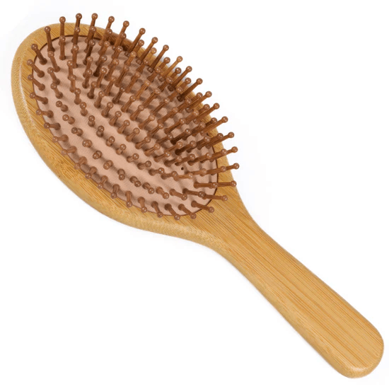 bamboo hairbrush with wooden bristles on a white background