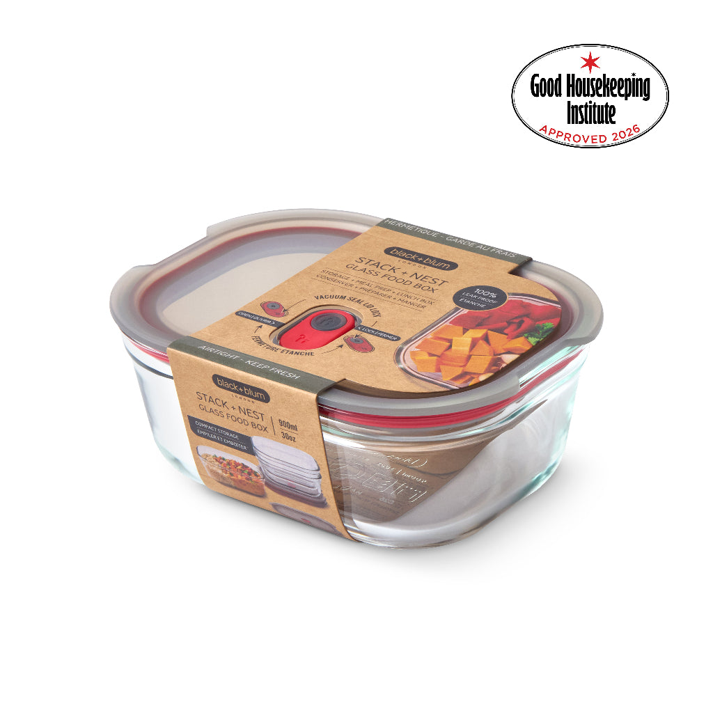 A clear glass stack-and-melt sandwich box with a brown lid, shown on a white background with a Good Housekeeping Institute 2026 approval badge in the top right corner.