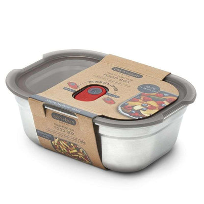 Stainless steel food storage container with gray lid and cardboard label on a white background