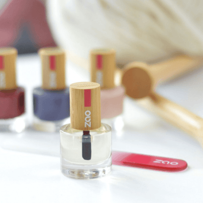 Nail Polish (8ml) with bamboo cap and brush, displayed with colorful polish bottles in soft natural light