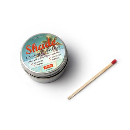 Tin of Shade sunscreen with a match on a white background