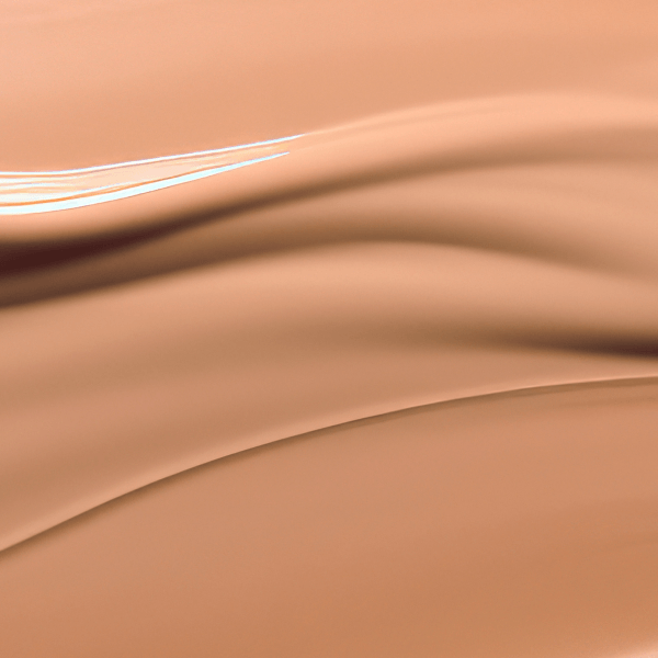 Close-up of smooth liquid texture in warm beige tones representing Second Skin Tinted ORGANIC Serums (30ml) natural skincare effect