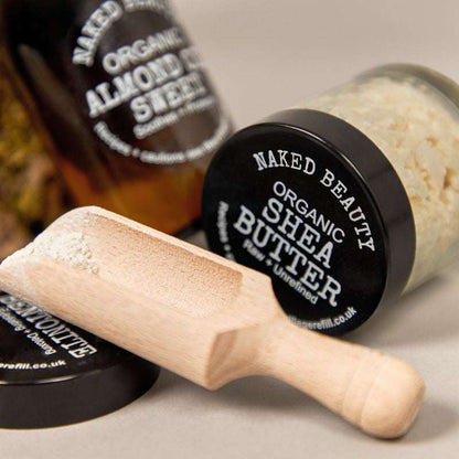 Shea Butter Raw Unrefined ORGANIC (per 40g) in a jar with a wooden scoop, natural skincare product.