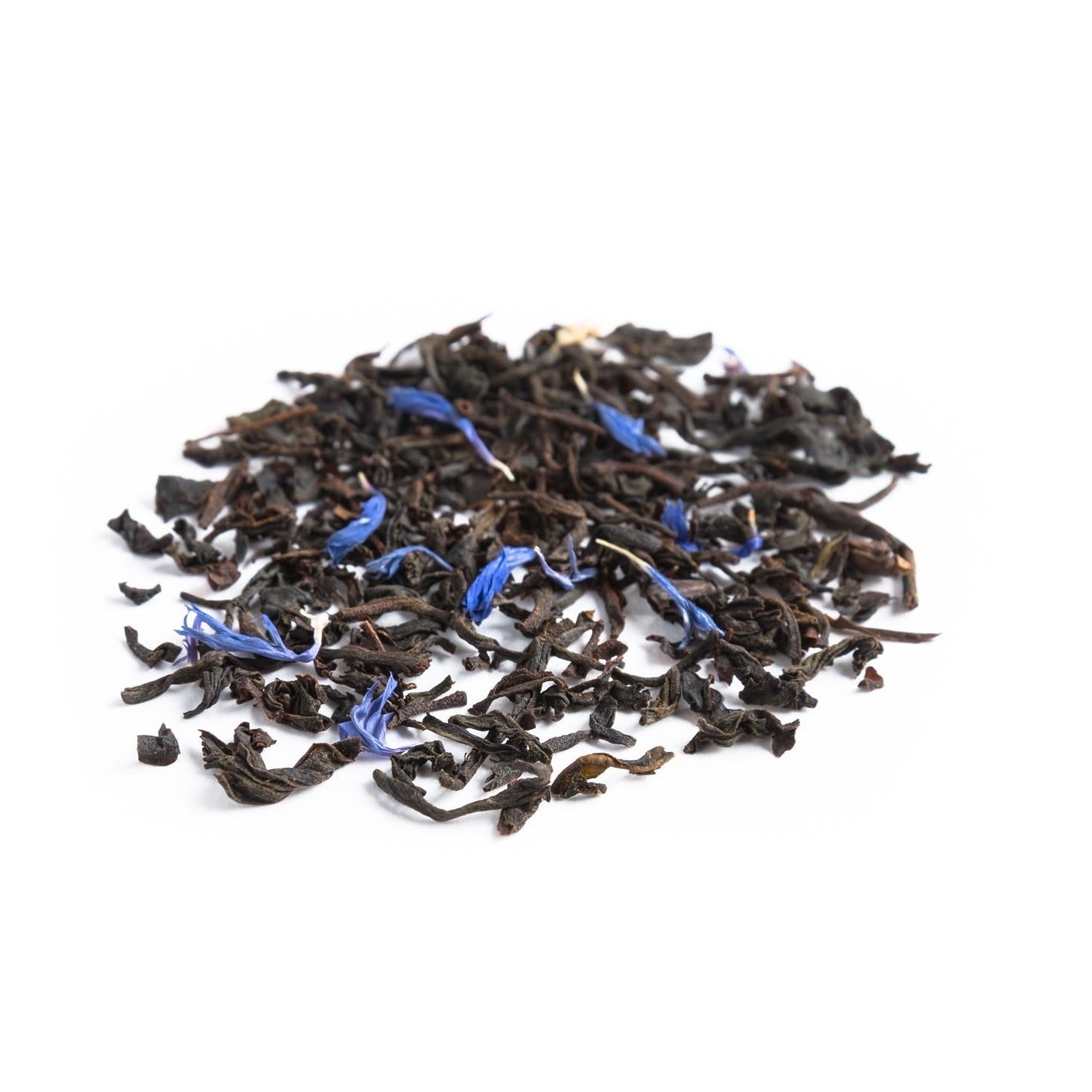 A pile of loose leaf black tea with pieces of blue cornflower petals scattered throughout.