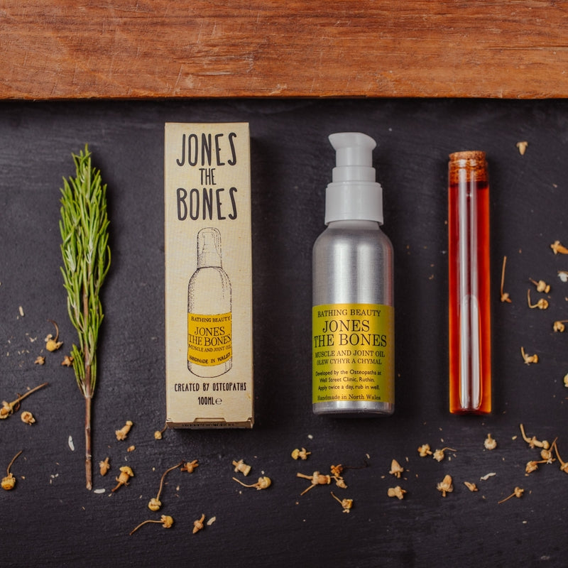 Jones the Bones skincare product set on a dark surface with natural elements