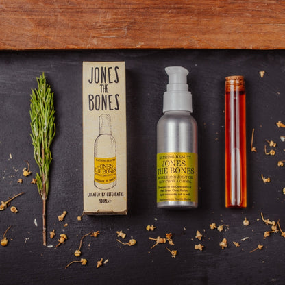 Jones the Bones skincare product set on a dark surface with natural elements