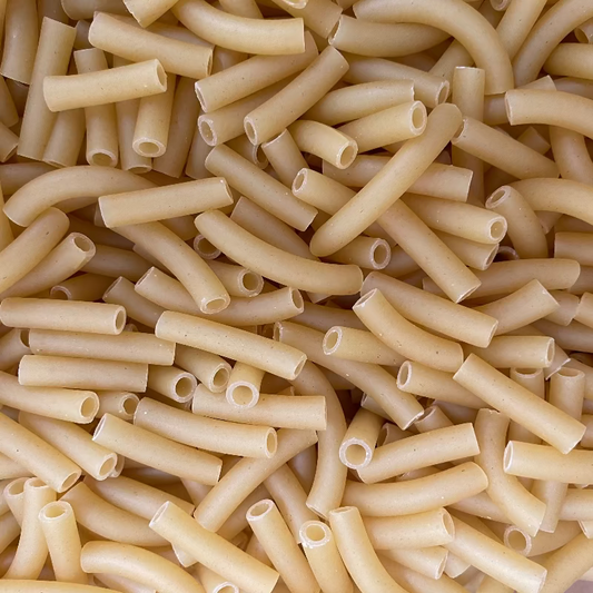 Close-up of uncooked penne pasta
