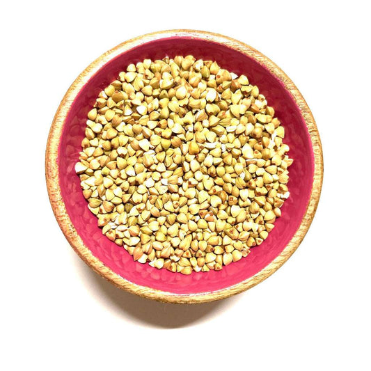 Red bowl filled with Raw Buckwheat Groats