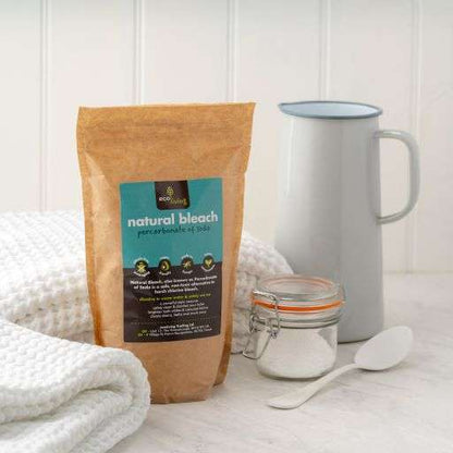 Natural Bleach (Green Bleach) (750g) in paper pouch with white towels, jar, and white enamel pitcher on counter
