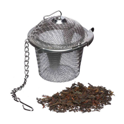 Stainless steel Loose Leaf Tea Infuser with a chain and a pile of loose tea leaves on a white background
